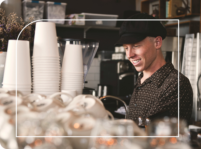 Small business barista making coffee